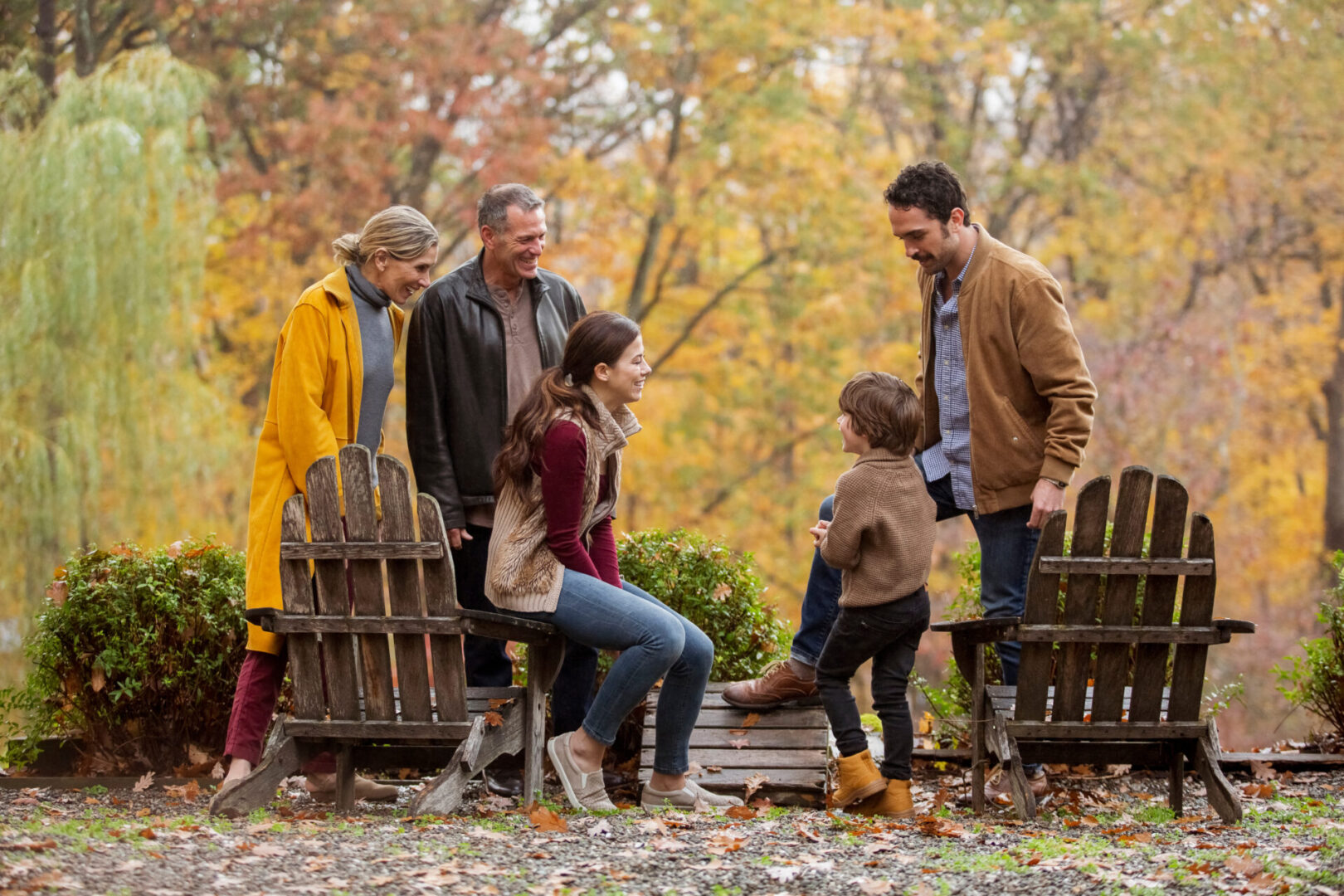 Happy multigenerational family spending leisure time in backyard